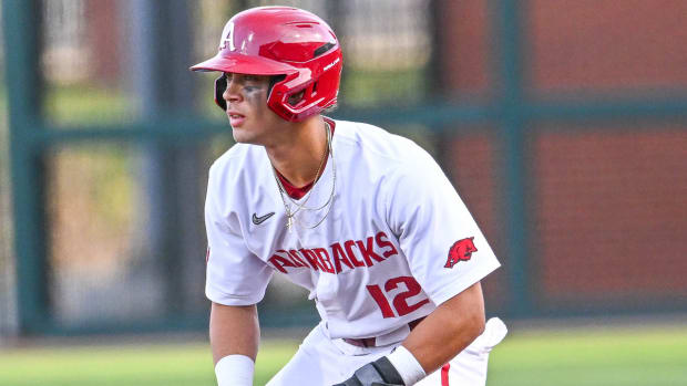 Razorbacks' Tavian Josenberger leads off first base against Alabama on Friday night.